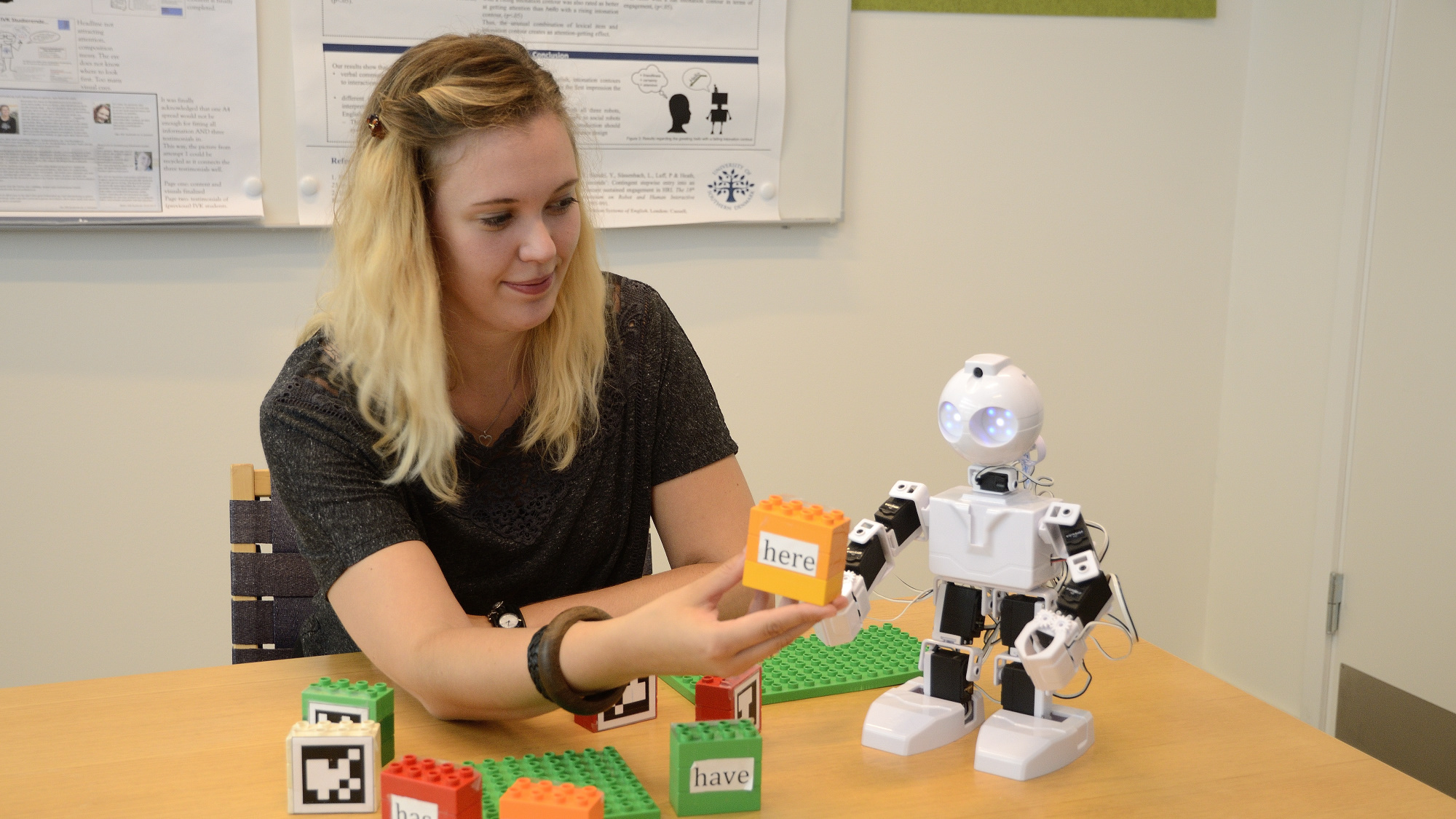 Rosalyn Melissa Langedijk experimenting with an EZ-Bot in the Lab.