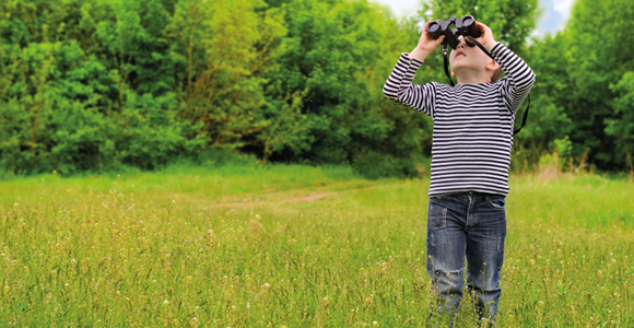 Boy with binoculars