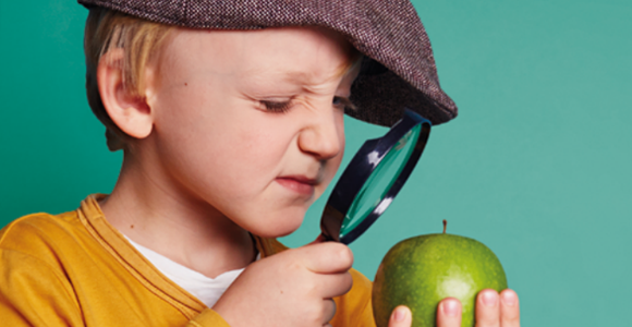 Boy with magnifying glass