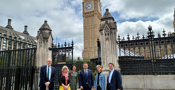 Ben Davies and colleagues outside the Houses of Parliament in Westminster.