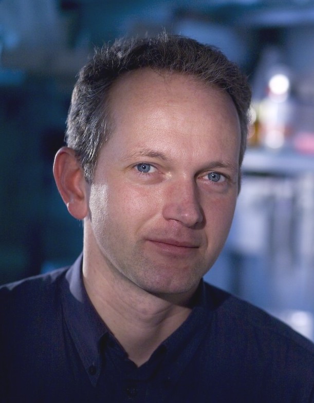 Head-and-shoulders portrait of Martin von Bergen indoors with a blurred background.