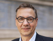 Head-and-shoulders portrait of Walter Fontana wearing glasses and a dark suit jacket.