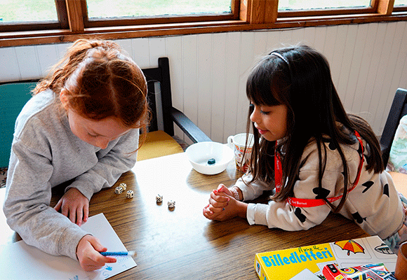 Children playing games and drawing.