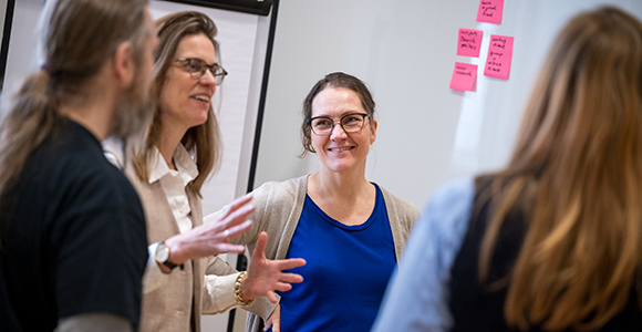 Tanya Karoli Christensen, Professor in Danish language and linguistics, listening to a colleague