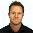 Head-and-shoulders portrait of Kasper Reitzel in a dark collared shirt against a plain light background.