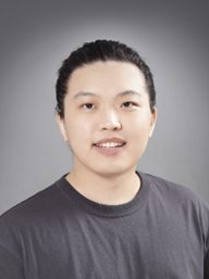 Yudong Zhou portrait headshot Headshot portrait of Yudong Zhou in a dark gray T-shirt against a gray gradient background.