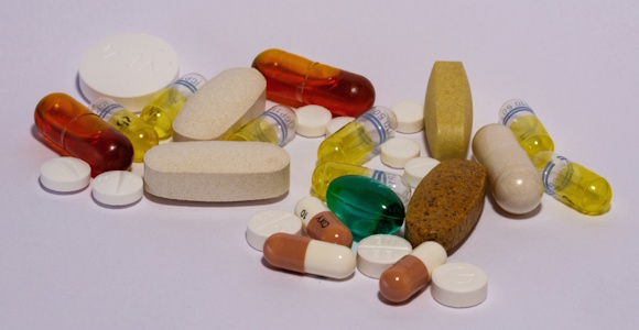 A lot of pills in different colours, forms and sizes