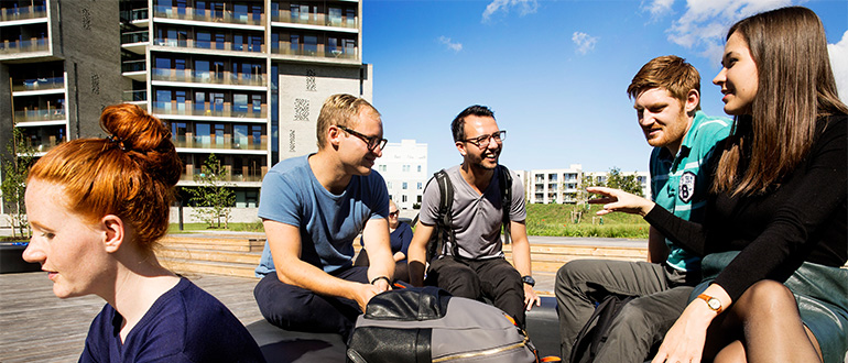 Students enjoying the sun in front of Campus House, Odense