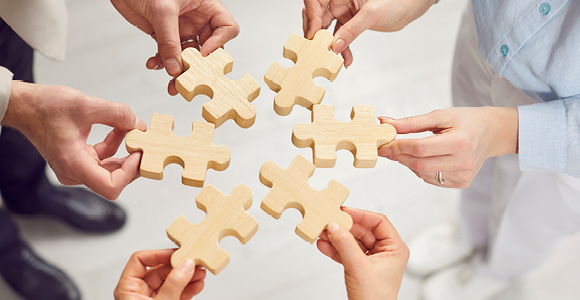 Puslespilsbrikker, der symboliserer universitetspædagogikum