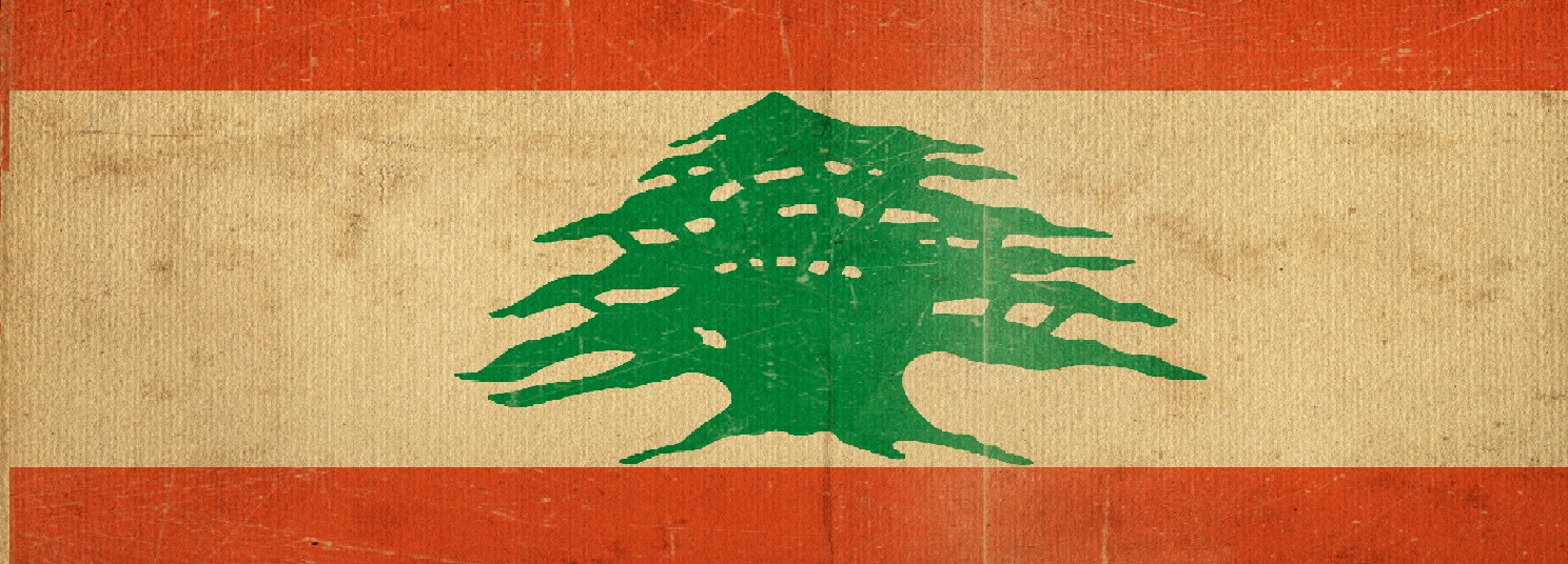 Weathered Lebanon flag with red stripes and a green cedar tree centered on a white band.