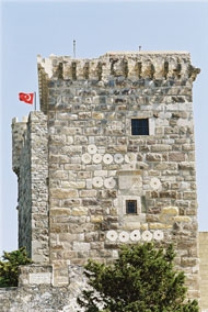 Fig. 33. The Italian Tower. The west front. Notice the great number of re-used column drums inserted in the masonry. 