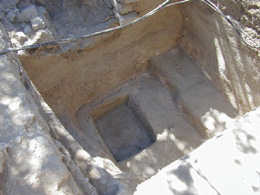 Fig. 21. Late water cistern built into ruined part of the large foundation. The outline of the robbed foundation shows as varying levels in the floor of the cistern.