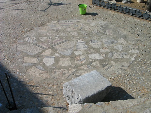 Fragments of floor mosaics placed in random order near the Snake Tower