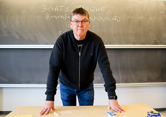 Jørgen Bang-Jensen in front of the board