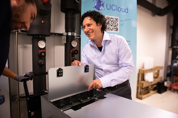 Claudio Pica standing next to the GPU
