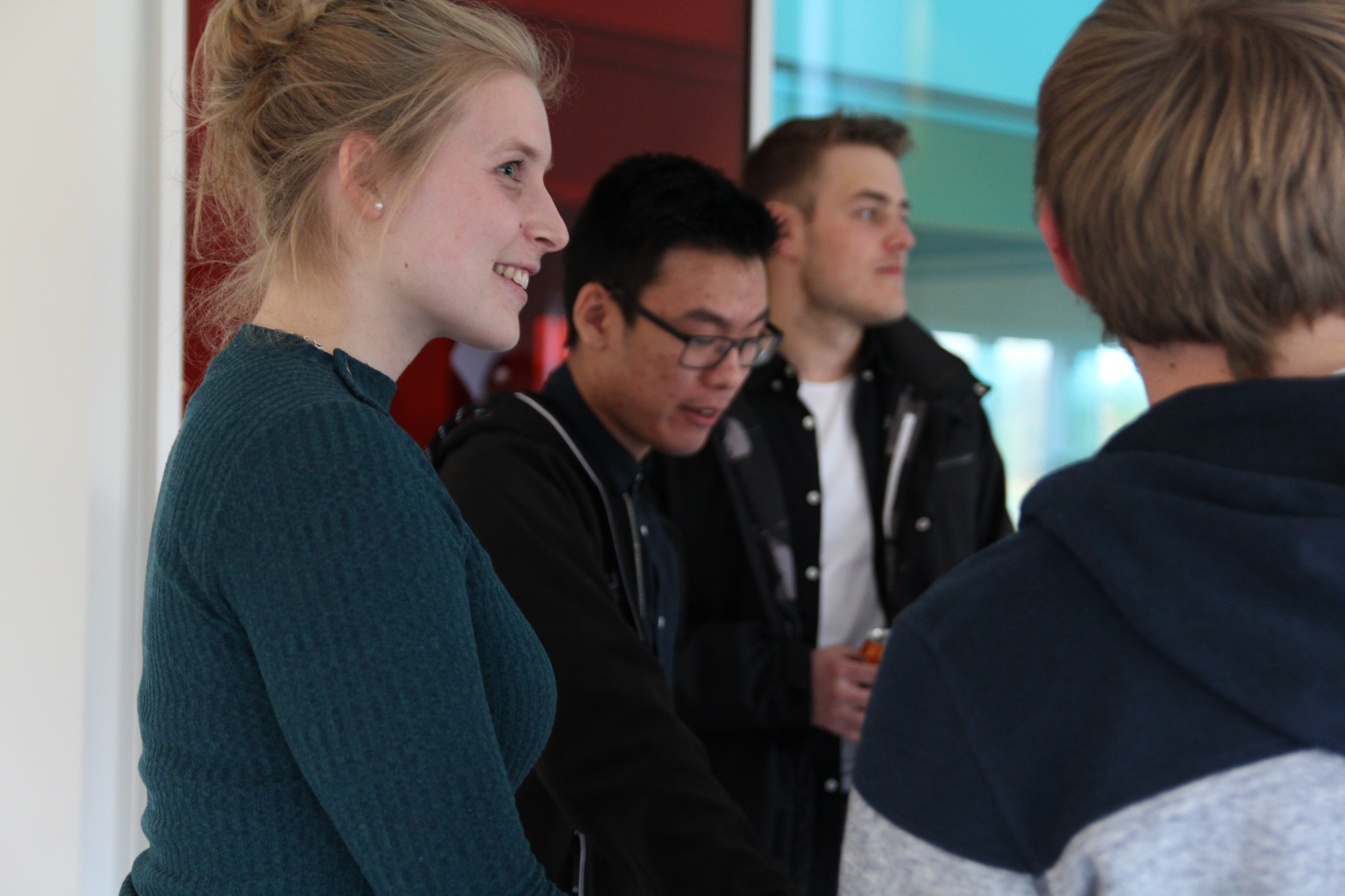 Students sociolizing at the announcement of the winners