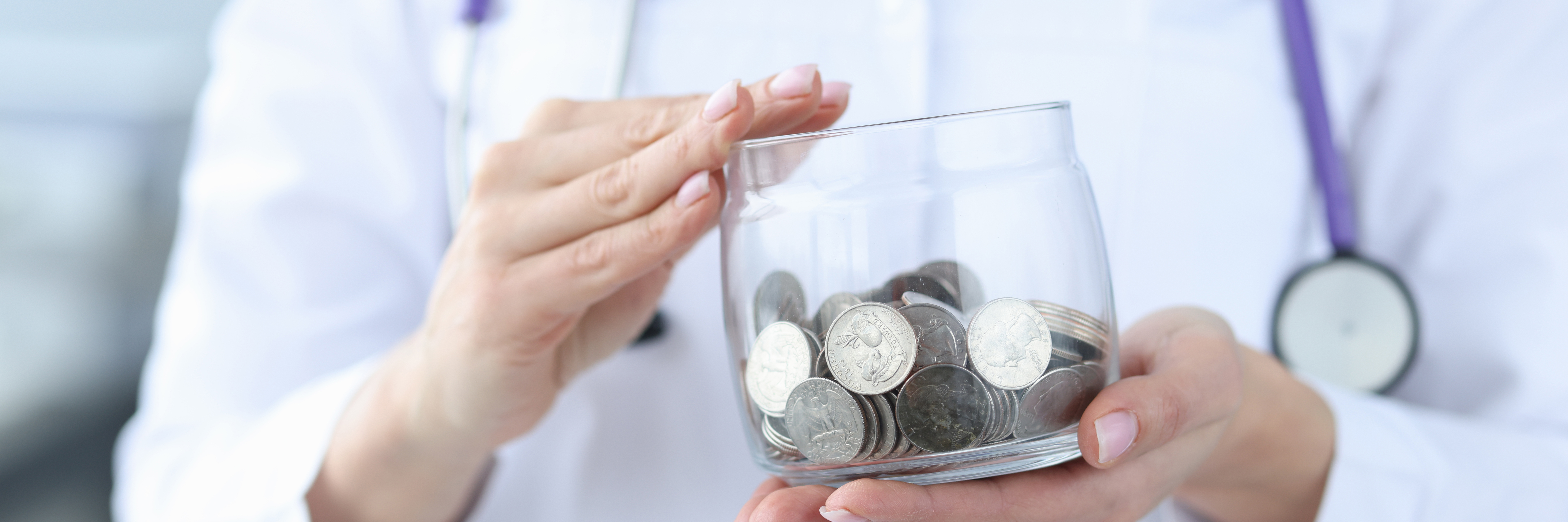 Physician holding coins