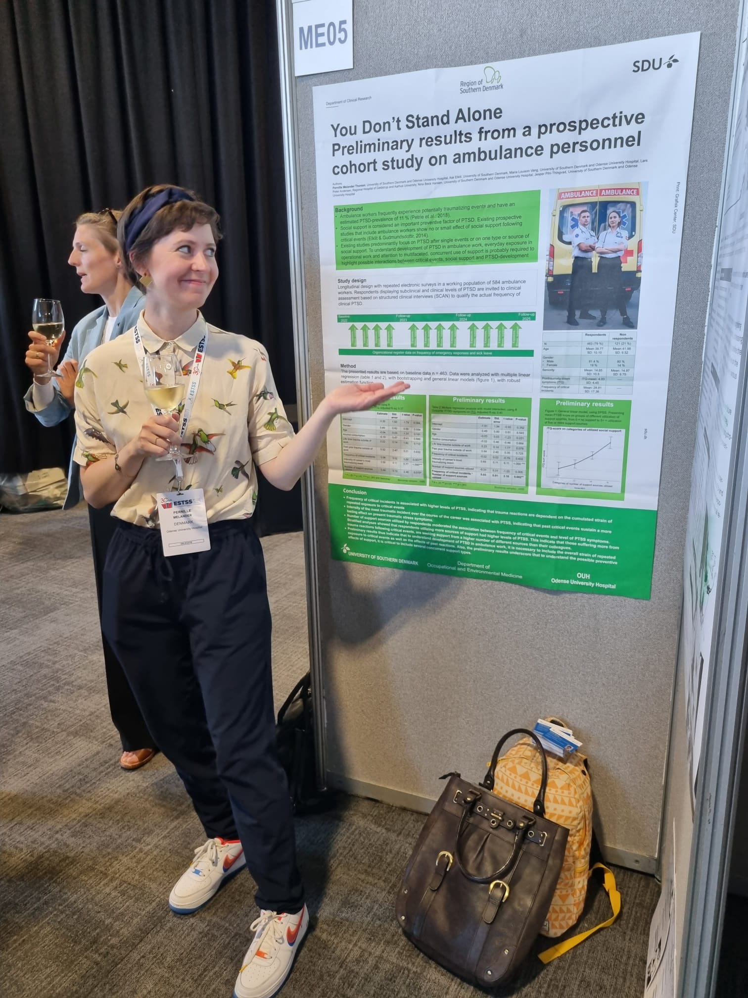 PhD student Pernille Melander in front of her poster at the ESTSS conference in Belfast
