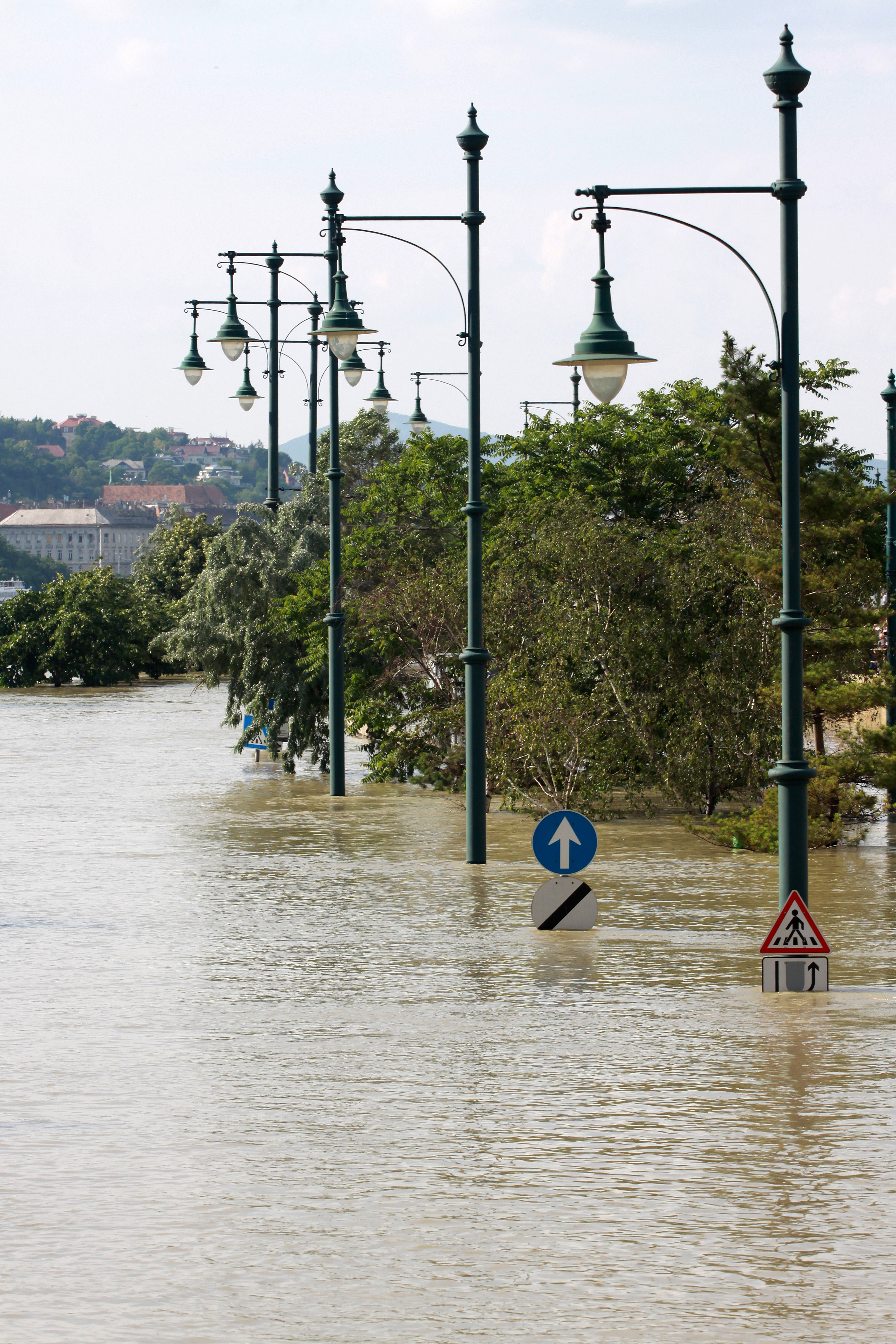 Road with oldfashioned lampposts flooded