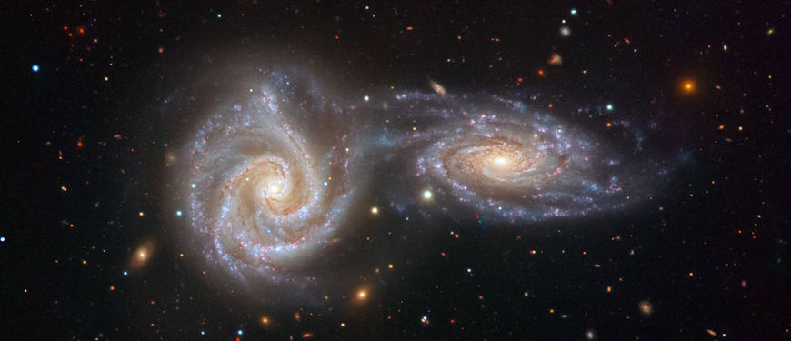 To spiralgalakser fanget i en tryllebindende, hvirvlende dans