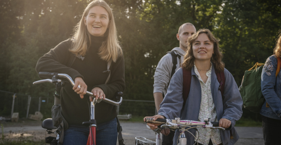 Two students with their bicycles